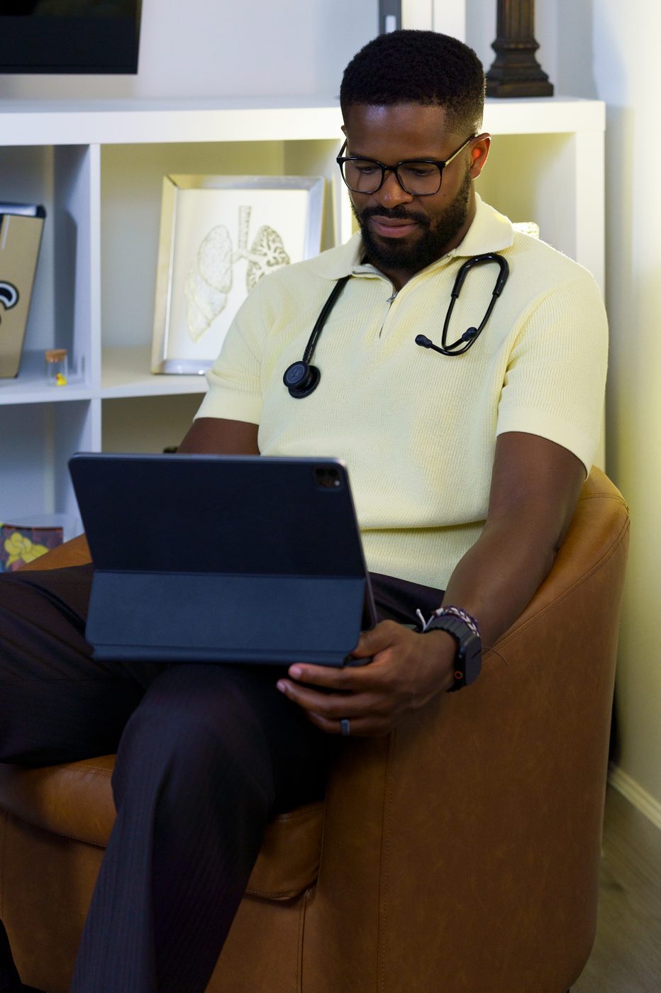 Dr. Ugo Ezema in clinical setting with stethoscope