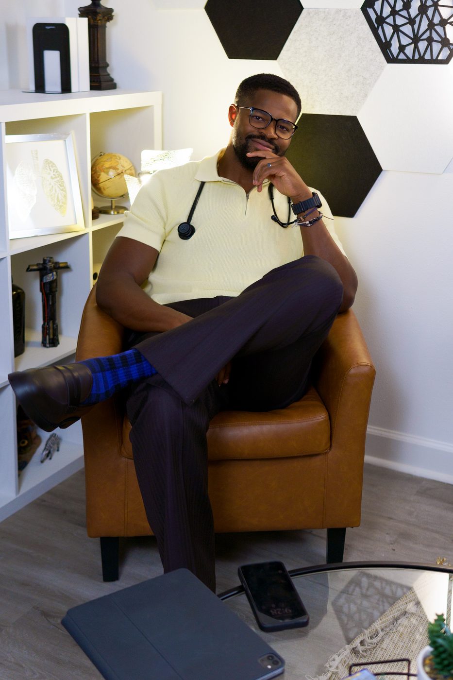 Dr. Ugo Ezema, thoughtful seated portrait